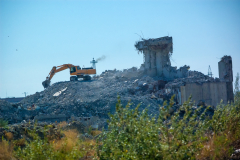 excavator demolishing an old building, the demolition of the building